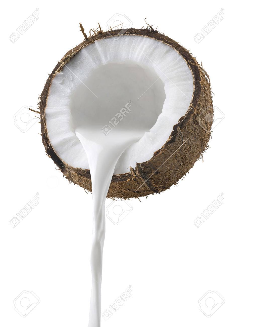 Coconut milk pouring side view isolated on white background as package design element - 73675635 Coconut milk pouring side view isolated on white background as package design element - 73675635