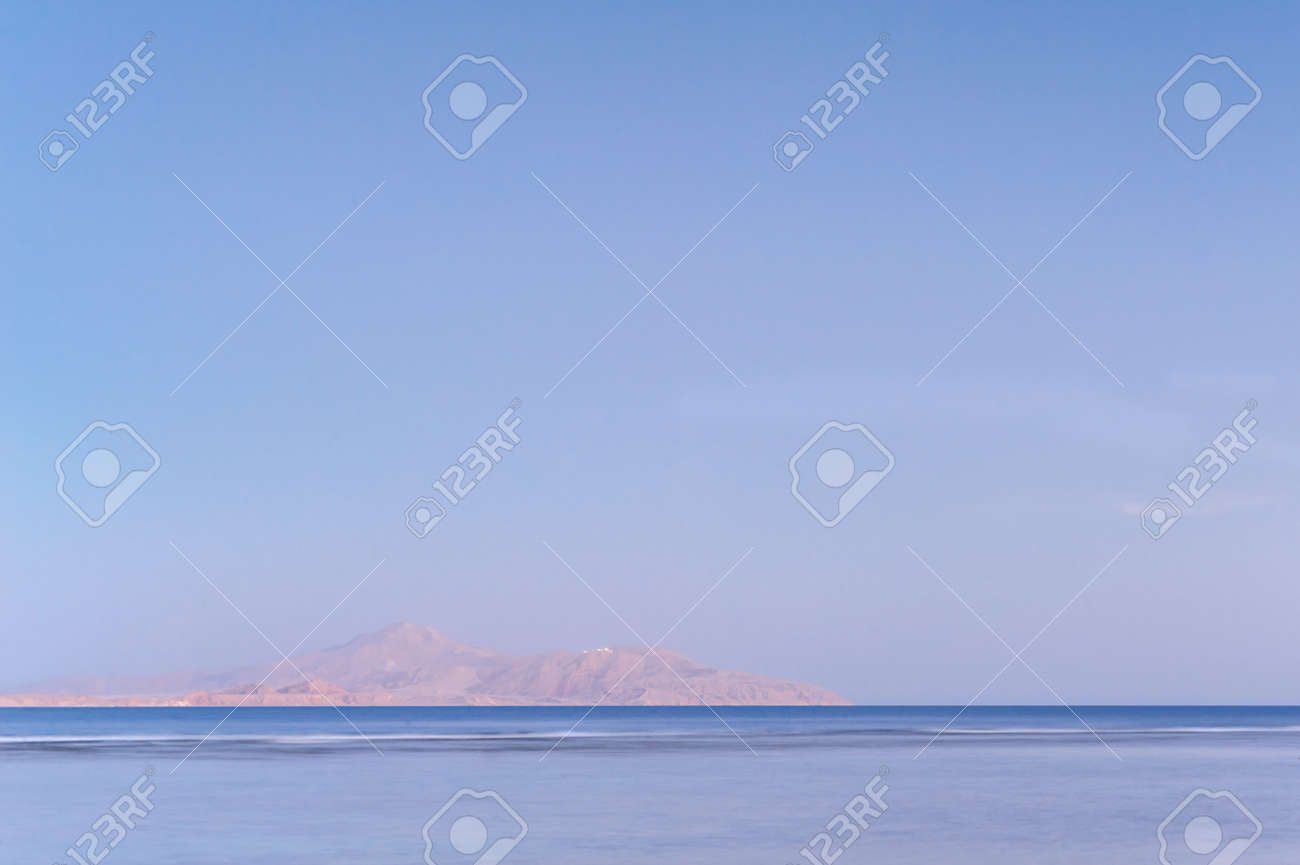 Soft sea ocean waves wash over golden sand background. Sunset, sunrise, sun. - 151310414 Soft sea ocean waves wash over golden sand background. Sunset, sunrise, sun. - 151310414