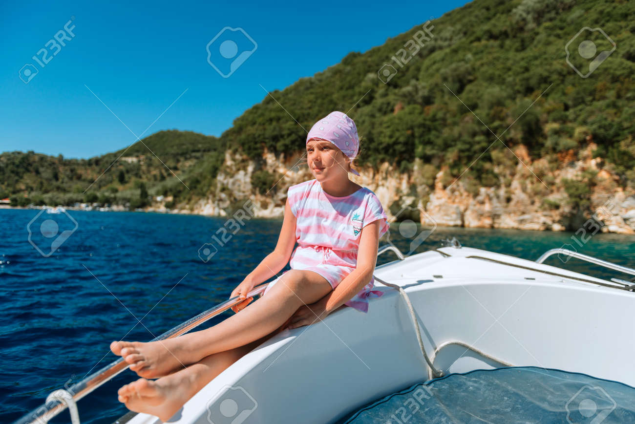 beautiful girl on speed boat in Greece. Little girl on a private yacht in the sea. Attractive young girl in posing on a yacht at a sunny summer day. - 168823489 beautiful girl on speed boat in Greece. Little girl on a private yacht in the sea. Attractive young girl in posing on a yacht at a sunny summer day. - 168823489