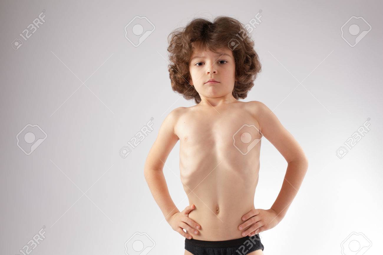 boy kid bowl hair shirtless Little Curly Boy Shirtless Stomach Sucked In And Shows Her Body. Gray  Background. Stock Photo, Picture and Royalty Free Image. Image 82568465.