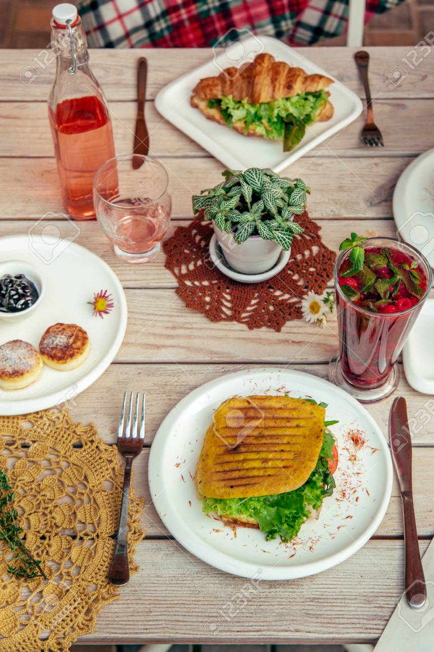 breakfast served cafe table with cheese pancakes sandwich