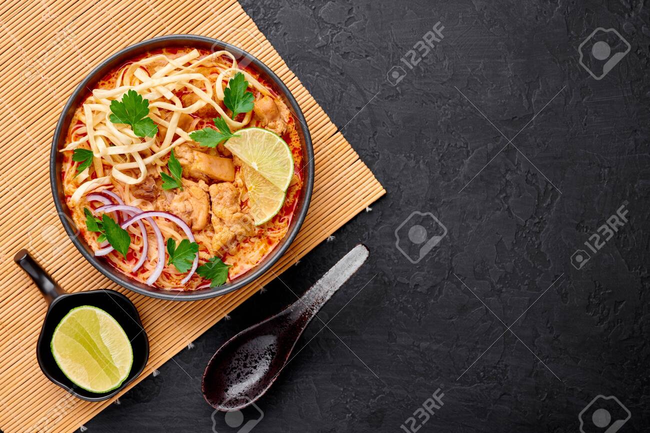 Khao Soi Gai Or Thai Coconut Curry Noodle Soup In Black Bowl Stock Photo Picture And Royalty Free Image Image 144831263