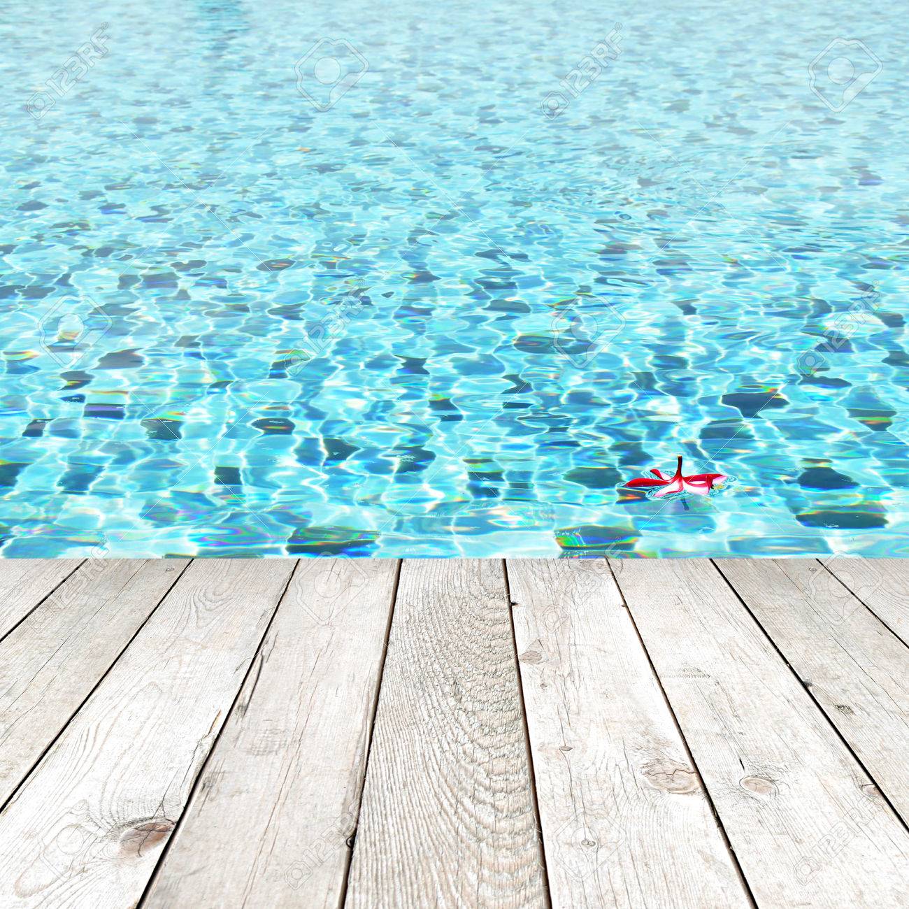 Swimming Pool Background wood plank on swimming pool water background - spa concept stock Swimming Pool Background wood plank on swimming pool water background - spa concept stock
