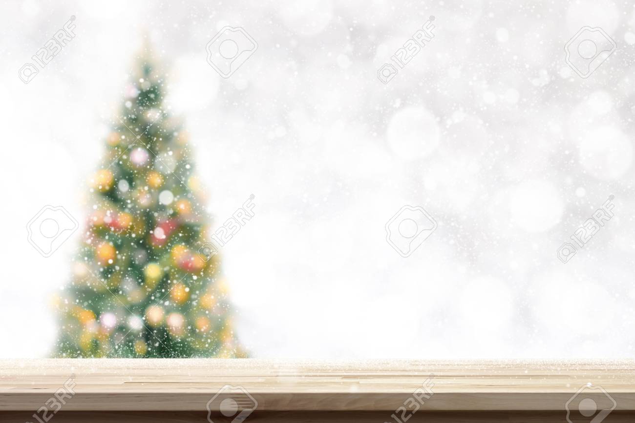 Wood Table Top On Blur Christmas Tree And White Bokeh Background