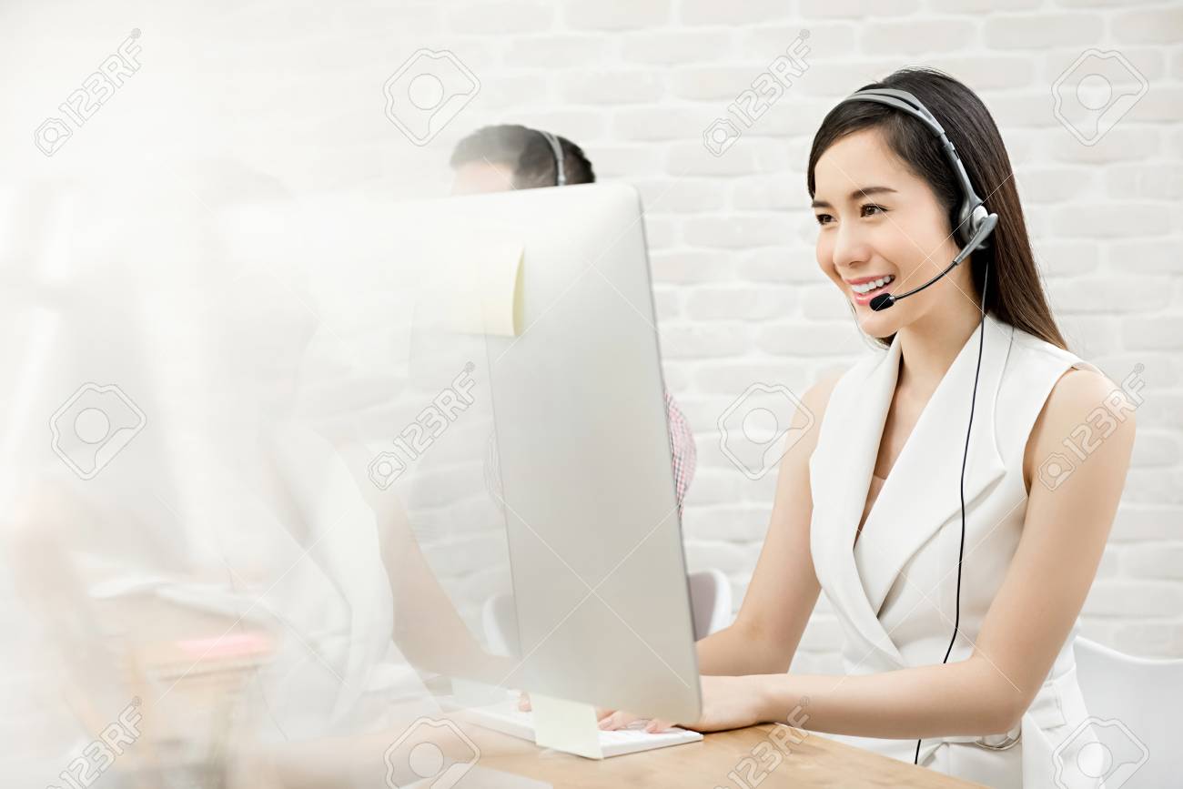 smiling beautiful asian woman telemarketing customer service stock working customer service