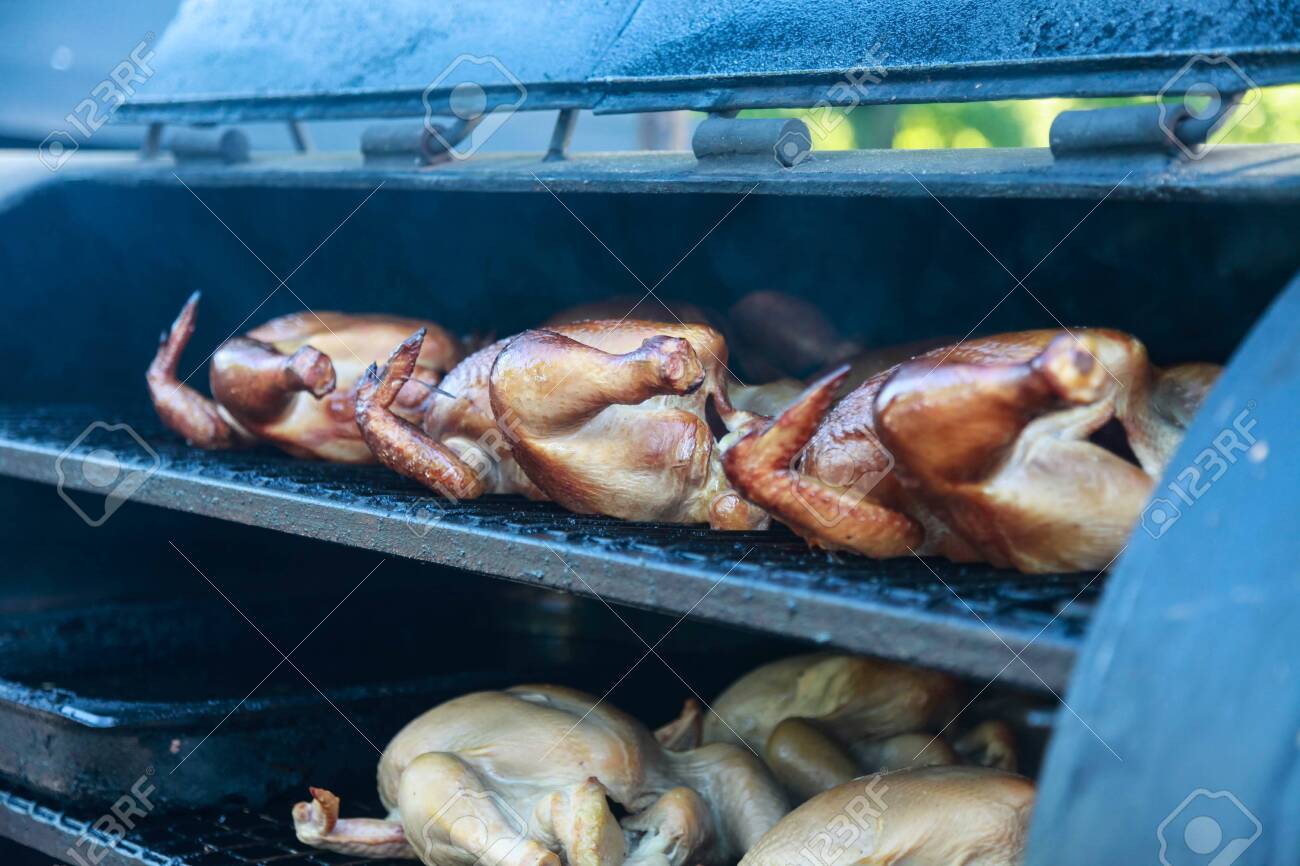 Cooking Chicken In A Huge Grill Street Cafe At The Food Festival