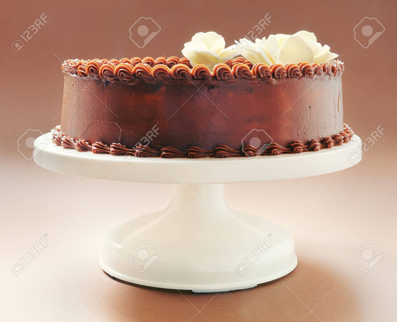 All Chocolate Birthday Cake On Brown Background Decorated With Yellow Flowers On Top Stock Photo Picture And Royalty Free Image Image 26166977