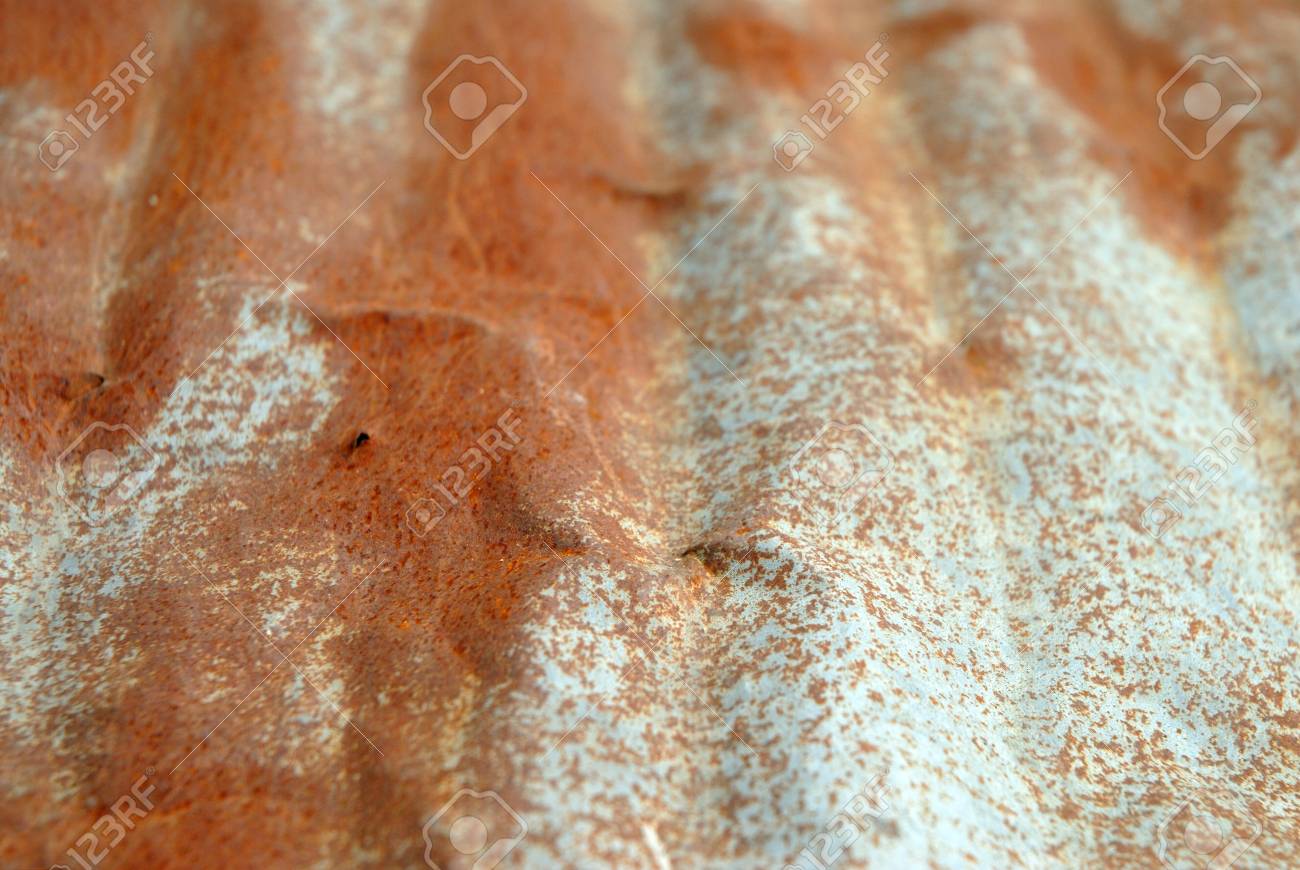 old rusty zinc metal sheet of roof surface closeup for background