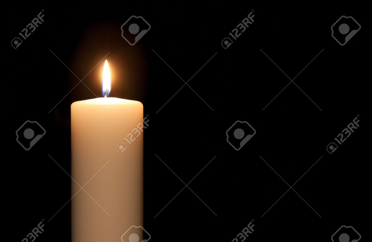 White candle isolated against a black background - 11713617 White candle isolated against a black background - 11713617