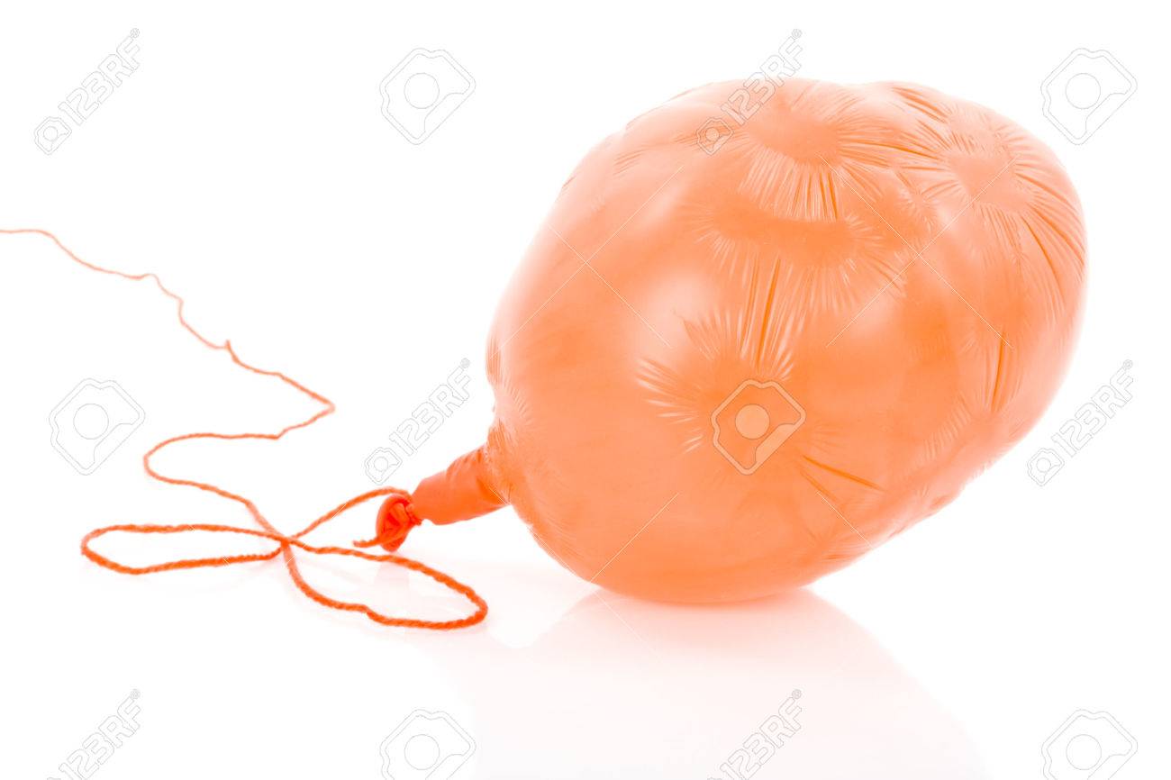 Deflated orange balloon at a rope; isolated over white background - 28447310 Deflated orange balloon at a rope; isolated over white background - 28447310