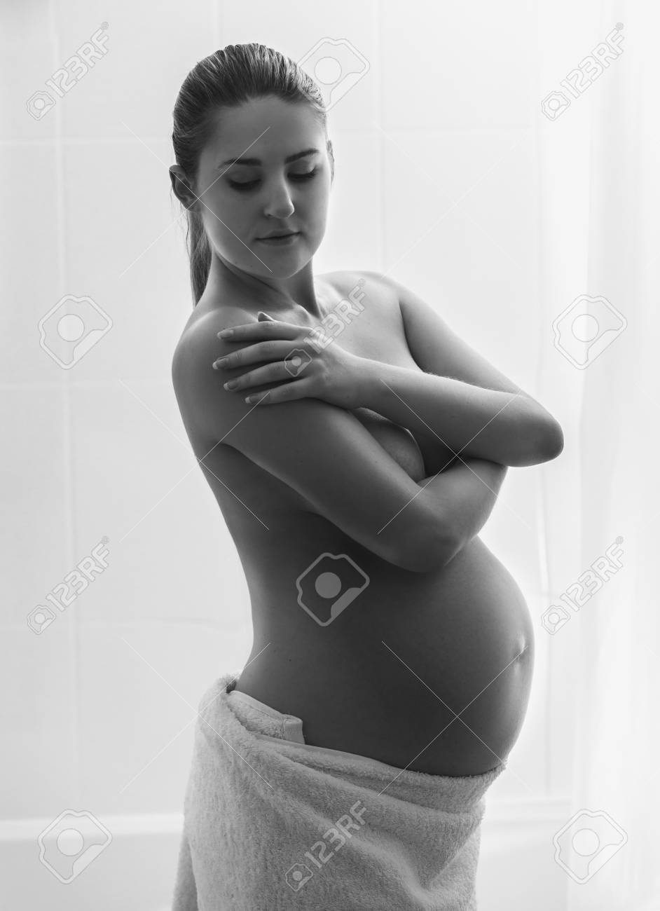 Pregnant woman showering