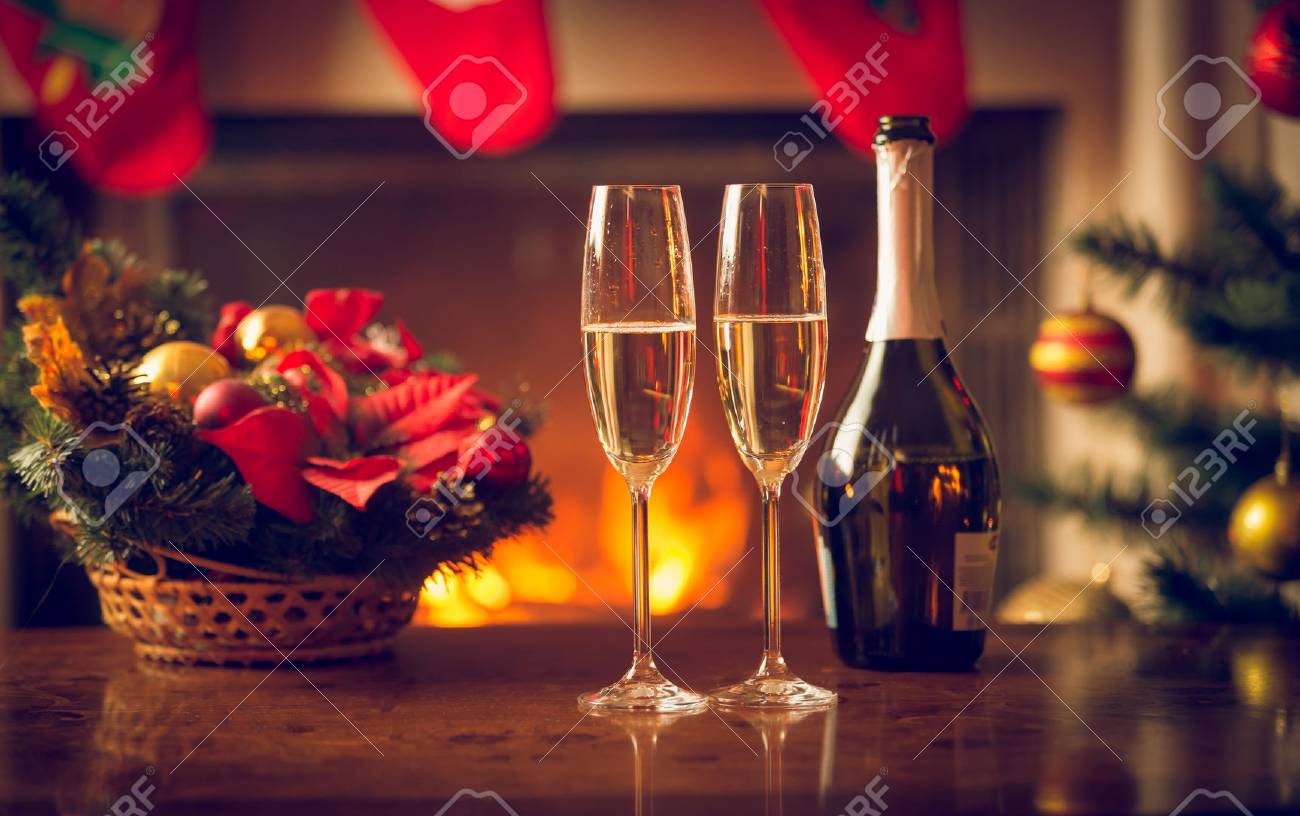 Closeup image of two glasses of champagne on Christmas table - 81100717 Closeup image of two glasses of champagne on Christmas table - 81100717