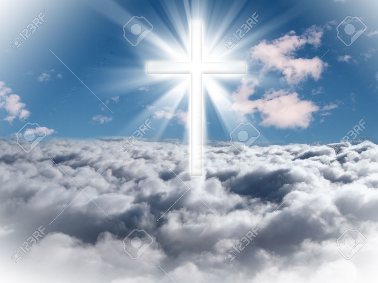 A cross in the sky with light rays on a bright sunny day. - 54766692 A cross in the sky with light rays on a bright sunny day. - 54766692