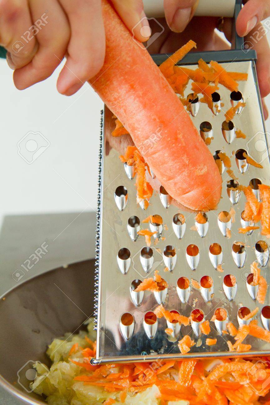 8981218-female-chef-grating-carrot-for-salad.jpg