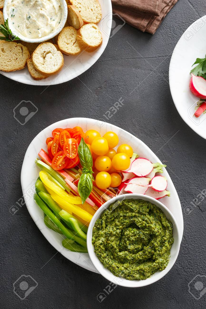 healthy snacks raw vegetables bread croutons with pesto sauce and