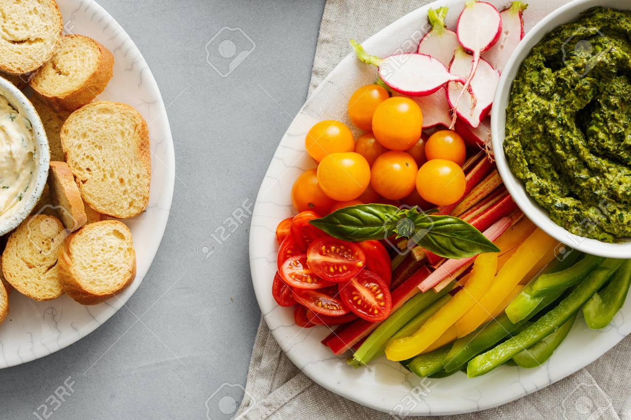 healthy snacks raw vegetables bread croutons with pesto sauce and