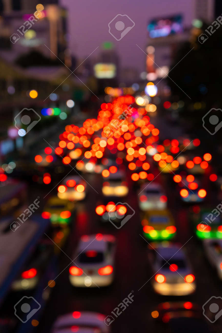 Blurred footage. Traffic jam on a wide street. Blurry brake lights. Dense city traffic. Transport interchange. Night footage - 144381076 Blurred footage. Traffic jam on a wide street. Blurry brake lights. Dense city traffic. Transport interchange. Night footage - 144381076