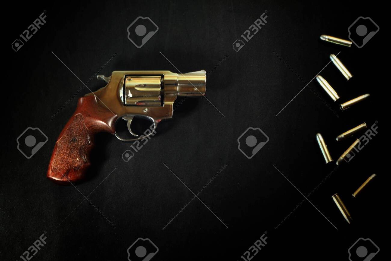 Revolver Gun And Bullet 38 Mm Size On Black Fabric Background Stock Photo Picture And Royalty Free Image Image