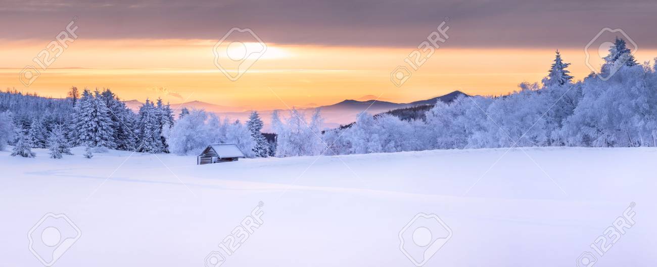 Panorama of an idyllic white winter landscape with a little wooden hut in background - 71780344 Panorama of an idyllic white winter landscape with a little wooden hut in background - 71780344