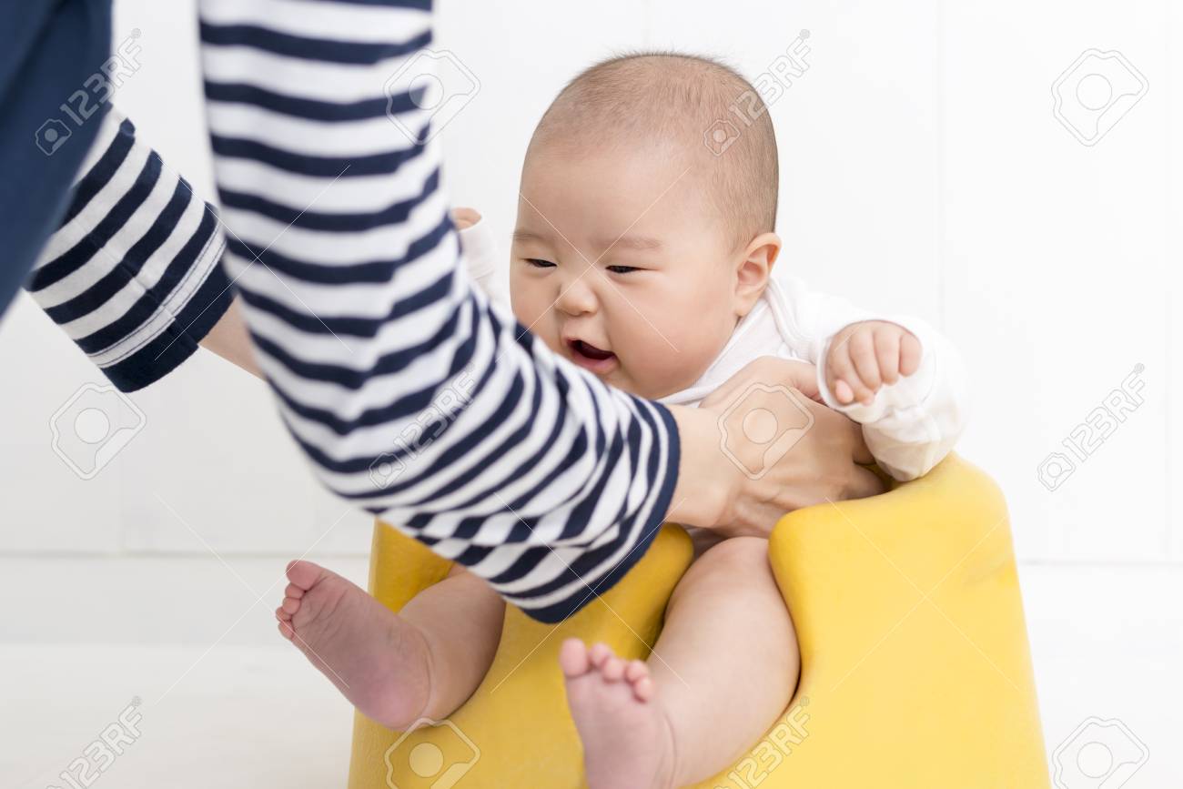 baby sitting in chair