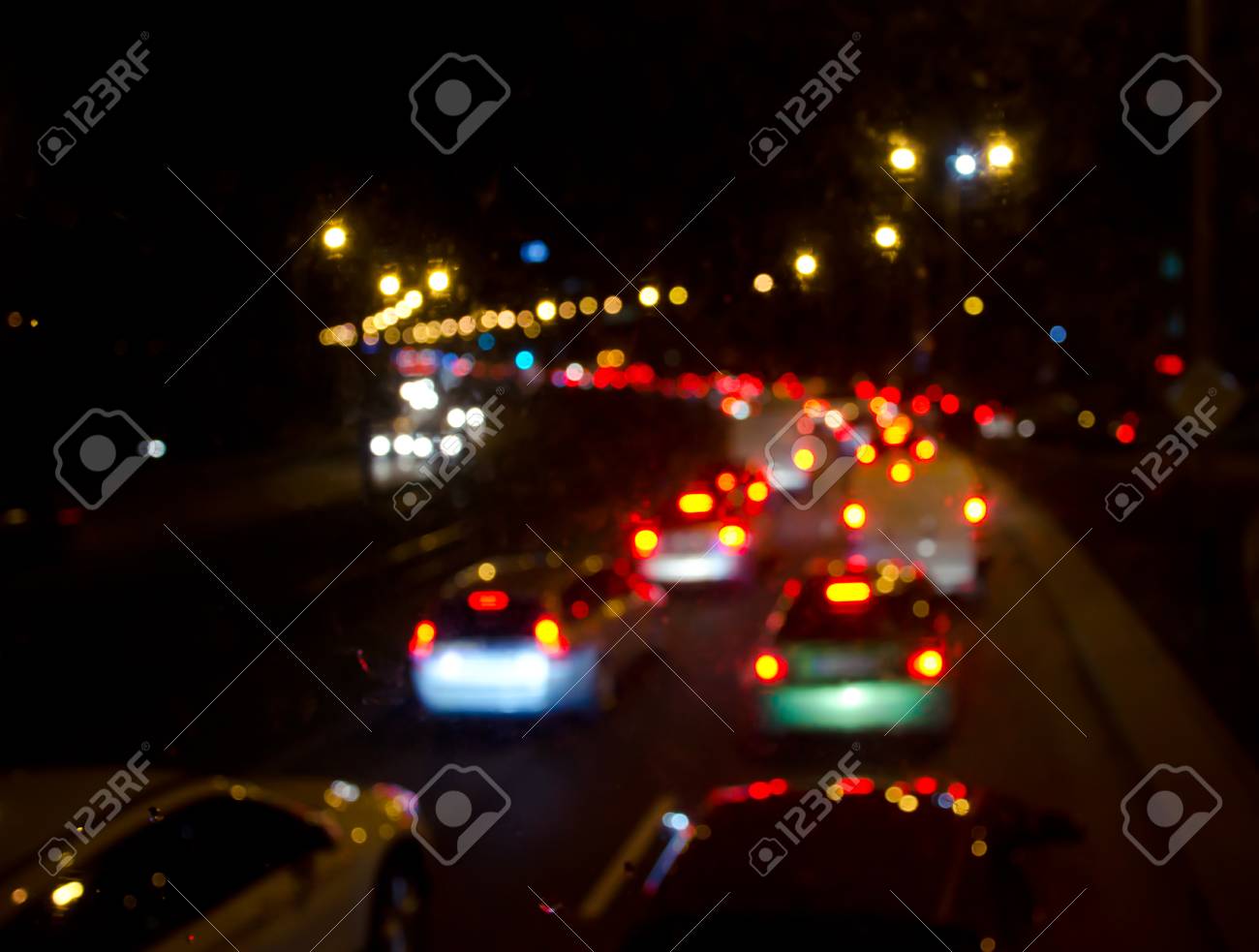 Out-of-focus Car Lights On A Road (blurred Silhouettes Of Cars In A Huge  Traffic Jam At Night) Stock Photo, Picture and Royalty Free Image. Image  90440539.