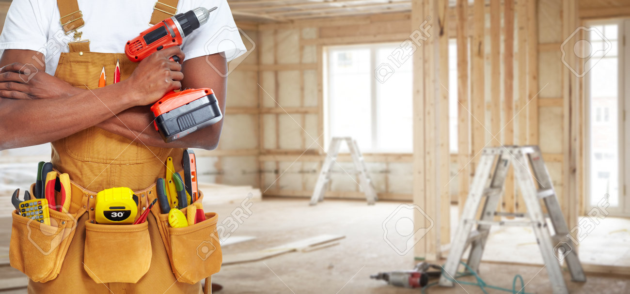 builder handyman with construction tools house renovation