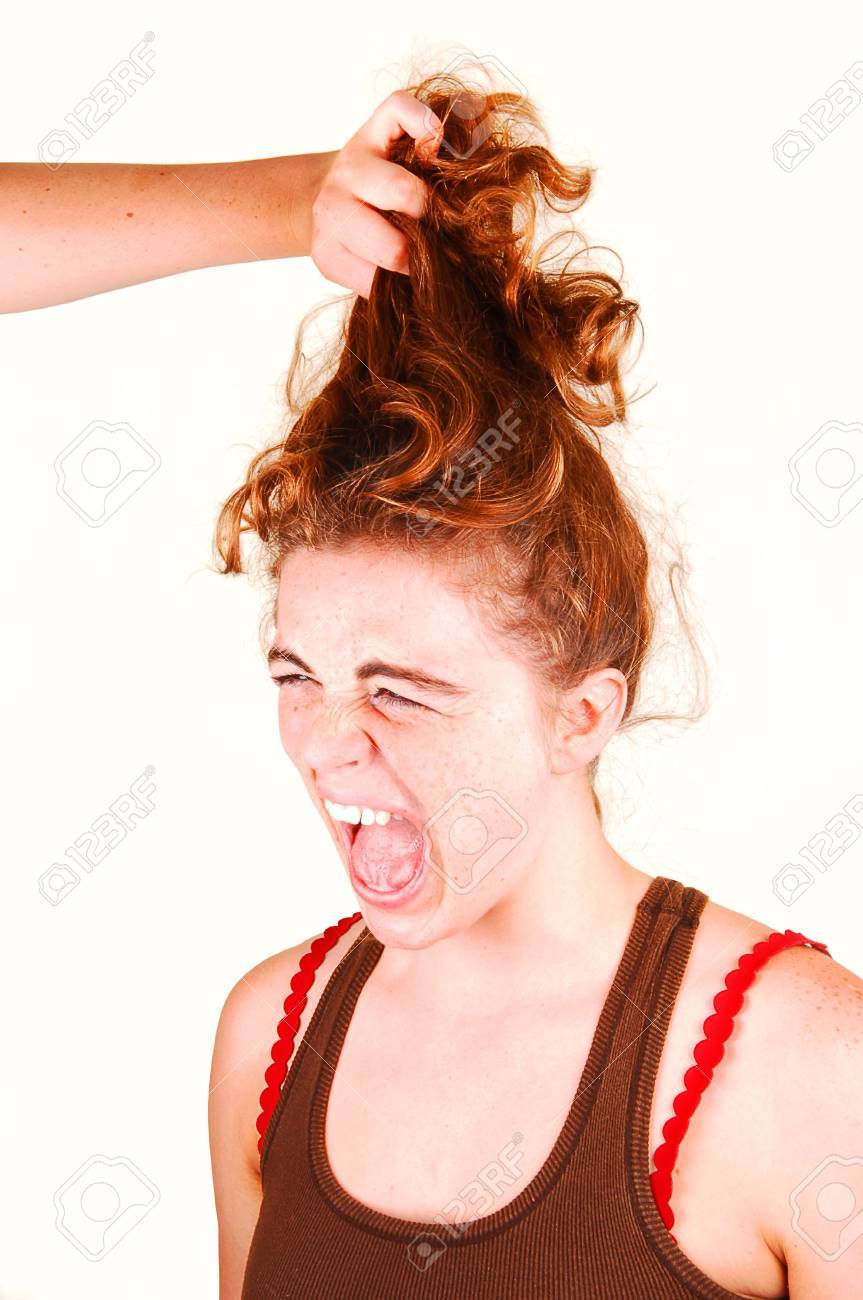 Young Woman Is Screaming When Another Girl Is Pulling Her Red Hair Up.  Stock Photo, Picture and Royalty Free Image. Image 4934842., image size:863x1300