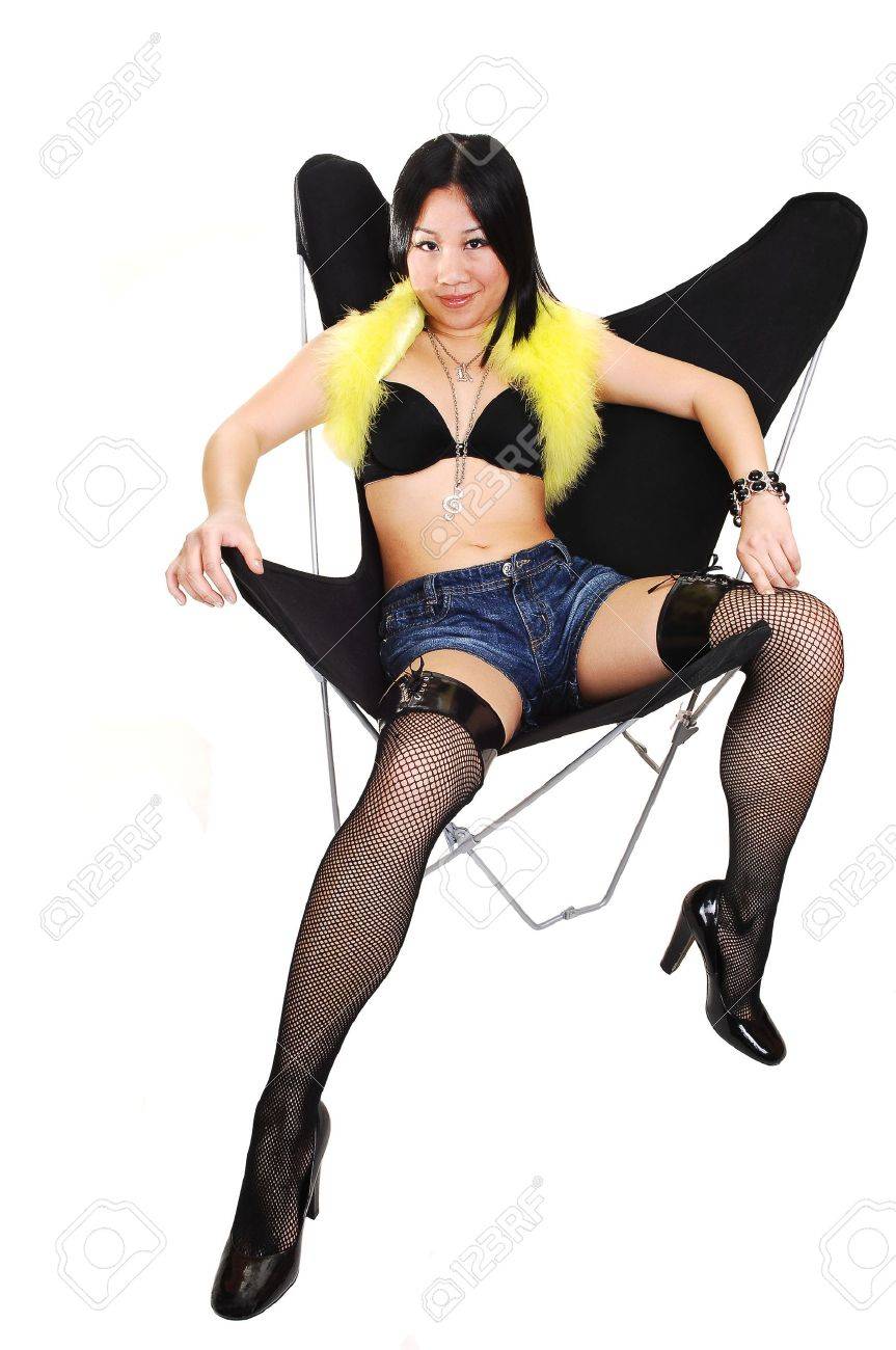 Pretty Chinese Woman In Shorts, Stockings And Bra, Sitting In A Black  Butterfly Chair, Showing Her Nice Legs, For White Background. Stock Photo,  Picture and Royalty Free Image. Image 7104851.