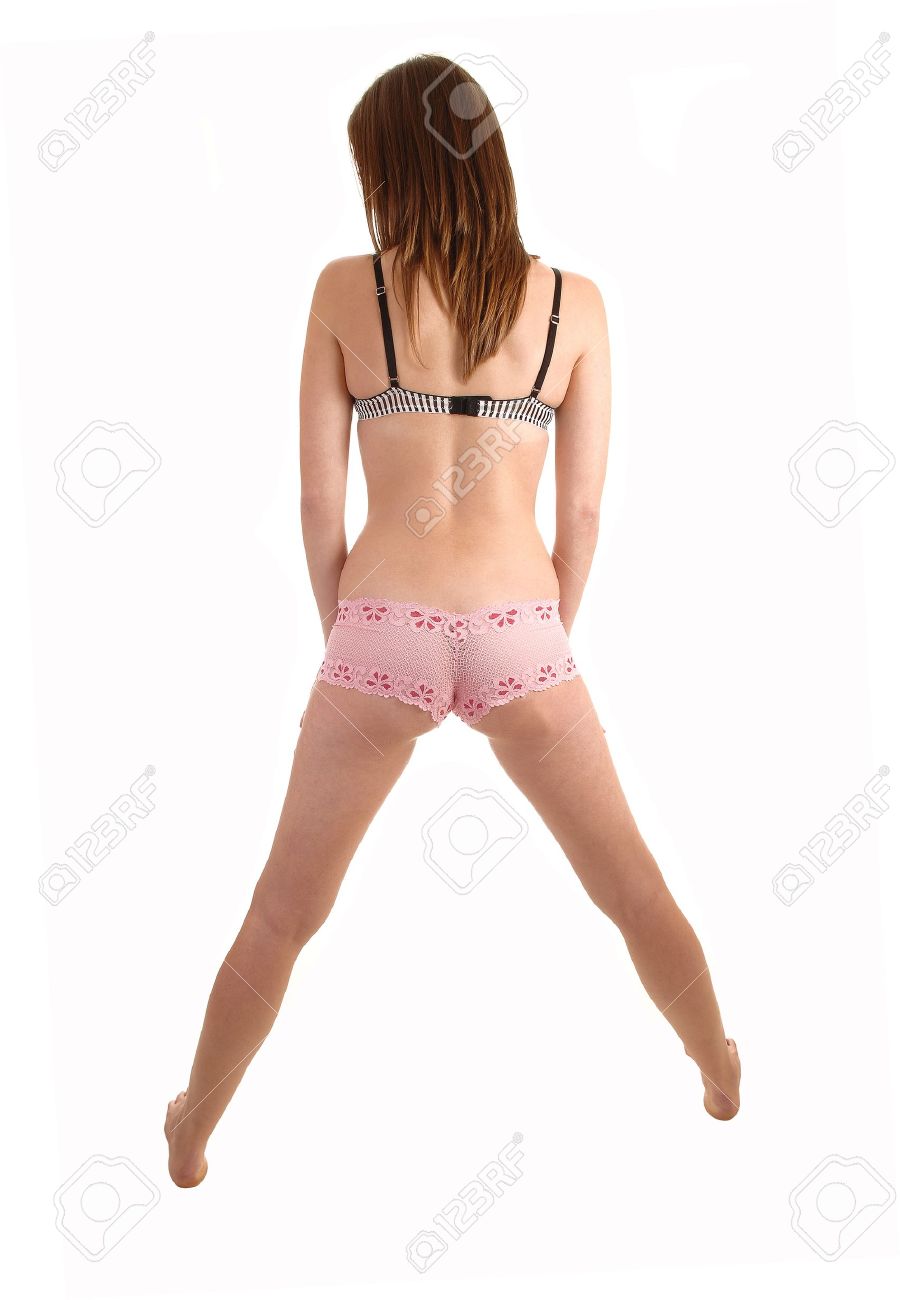 A Pretty Slim And Young Woman Standing From The Back In Lace Panties Anda  Bra With Her Legs Spread And Bare Feet For White Background. Stock Photo,  Picture and Royalty Free Image.