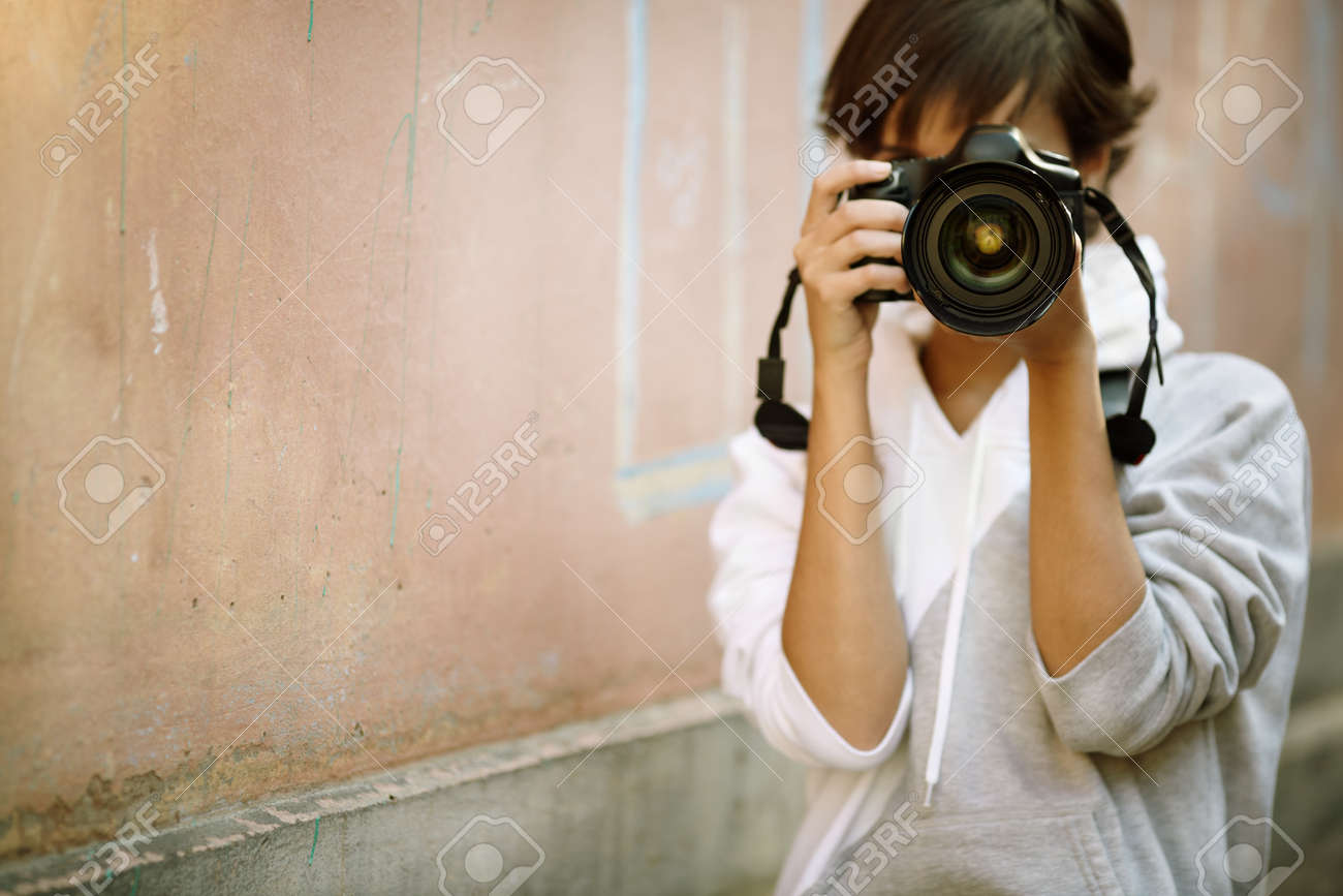 Female Photographer With Professional Slr Camera Natural Light - 