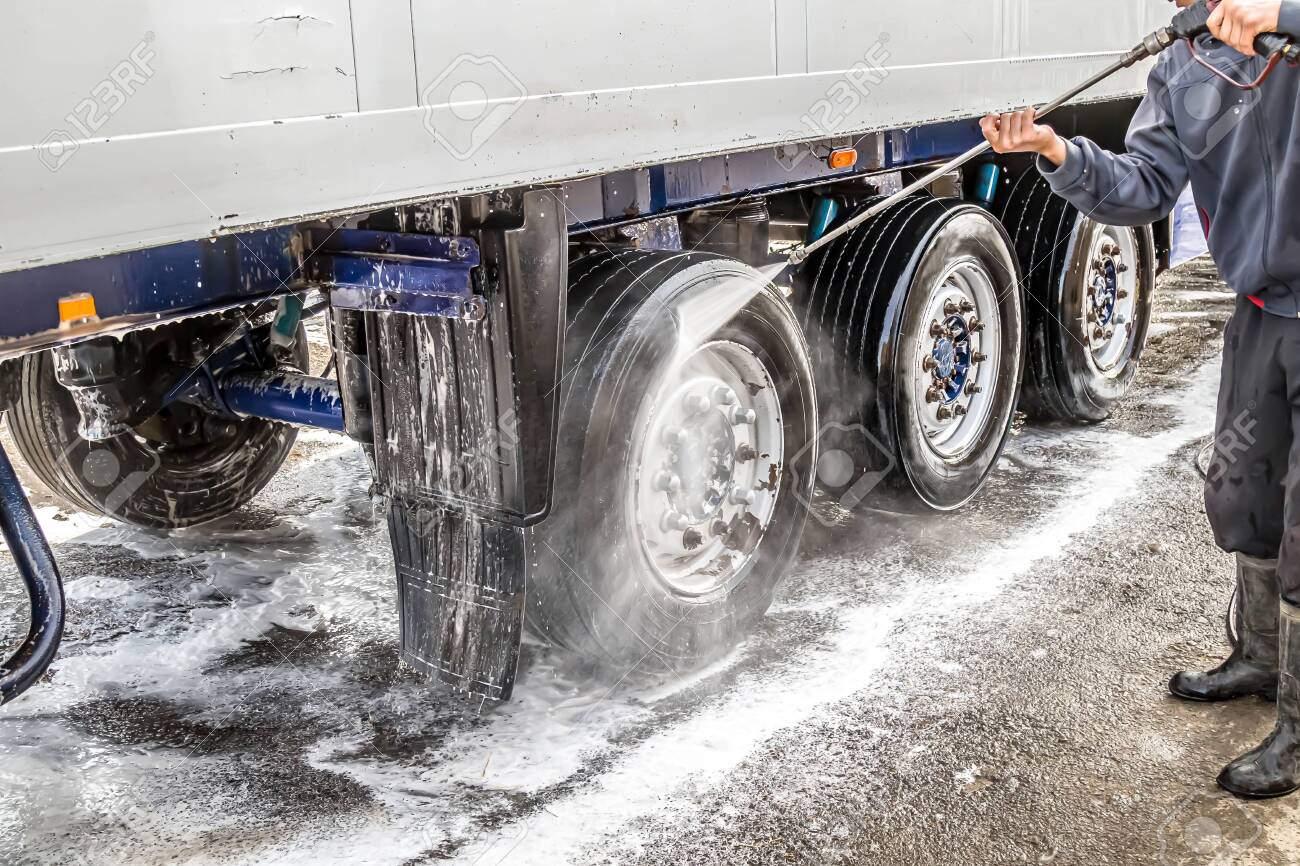 Washing a truck outdoors. Close-up. Car wash with detergents. - 136205852 Washing a truck outdoors. Close-up. Car wash with detergents. - 136205852