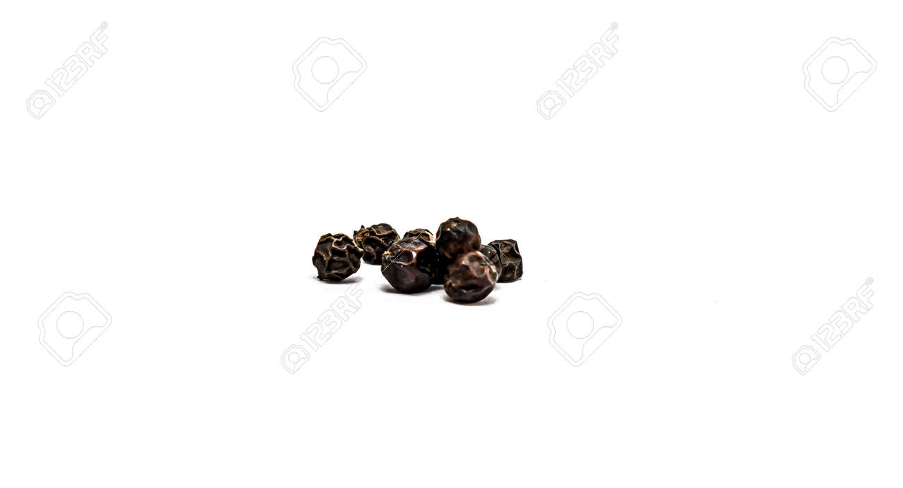 Peas of black allspice close-up on a white background. - 155722703 Peas of black allspice close-up on a white background. - 155722703