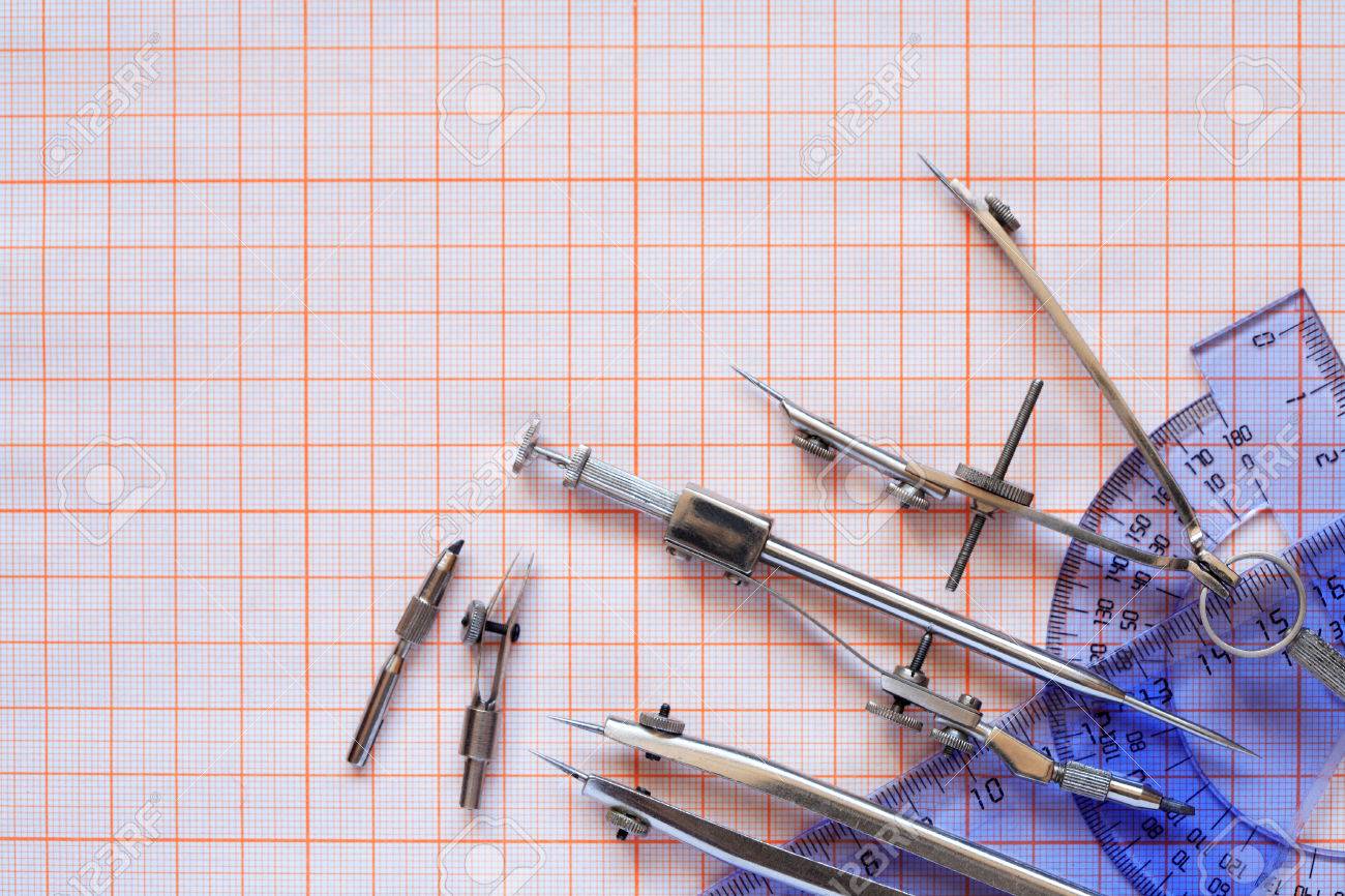 set of drawing instrument and rulers on graph paper stock photo
