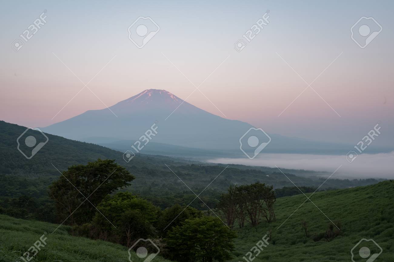 Mt. Fuji over a Lake Captured from a Hill in Summer - 100567312 Mt. Fuji over a Lake Captured from a Hill in Summer - 100567312