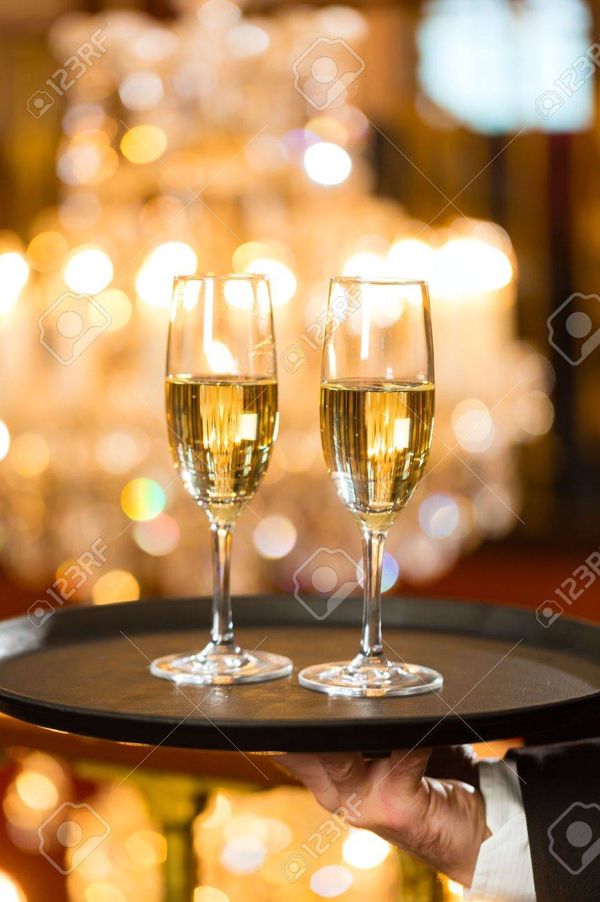 Fancy Restaurant Background waiter served champagne glasses on a tray in a fine dining Fancy Restaurant Background waiter served champagne glasses on a tray in a fine dining
