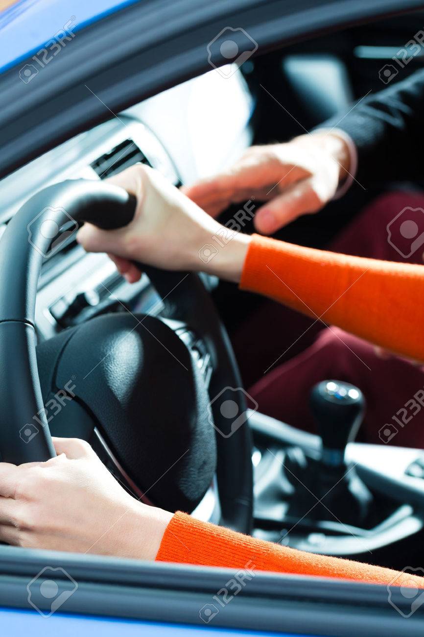 driving school young woman steer a car with the steering wheel