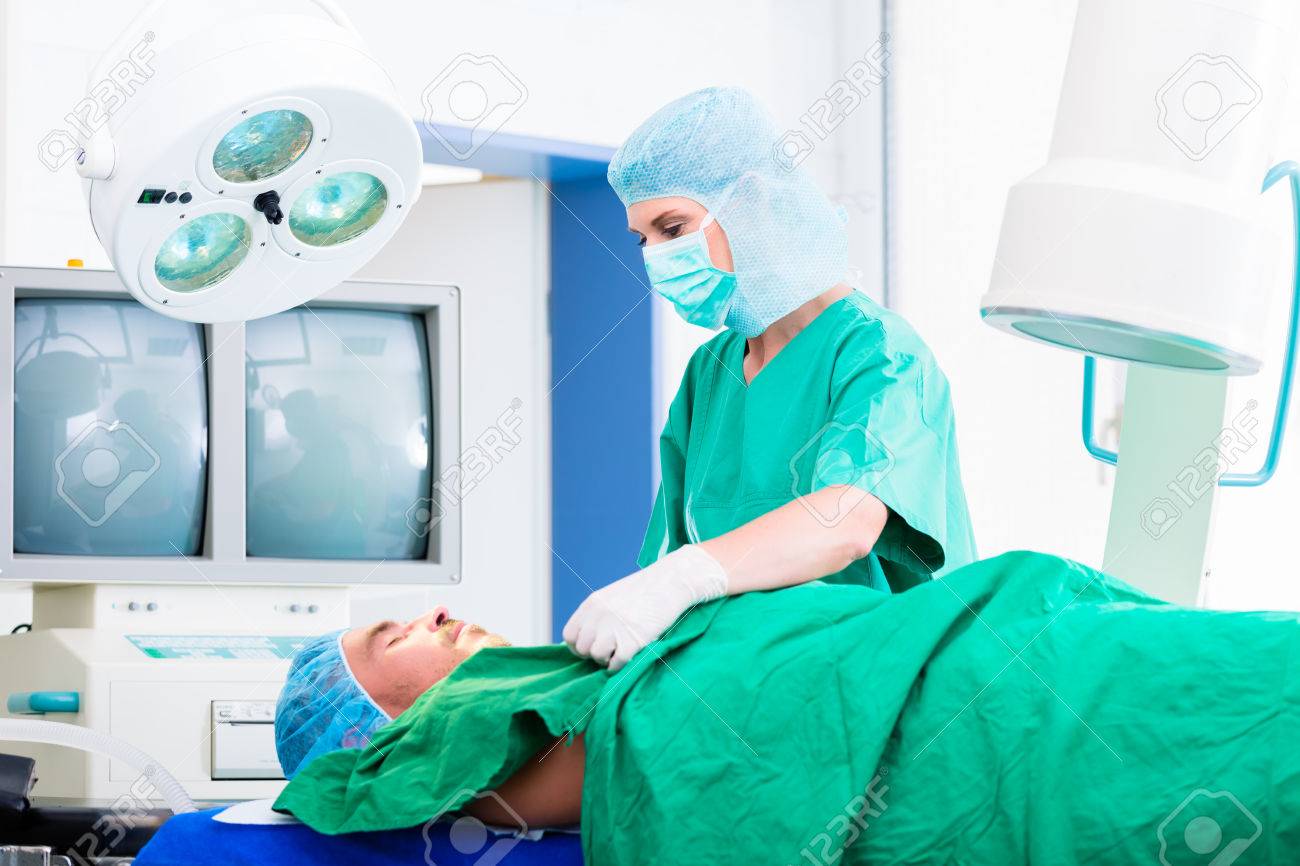 orthopedic surgeon doctor operating patient in surgery or hospital