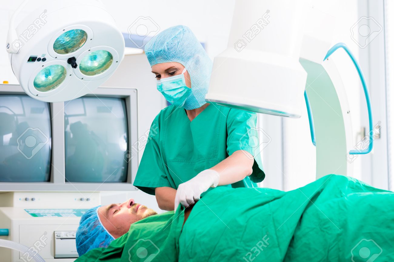 orthopedic surgeon doctor operating patient in surgery or hospital