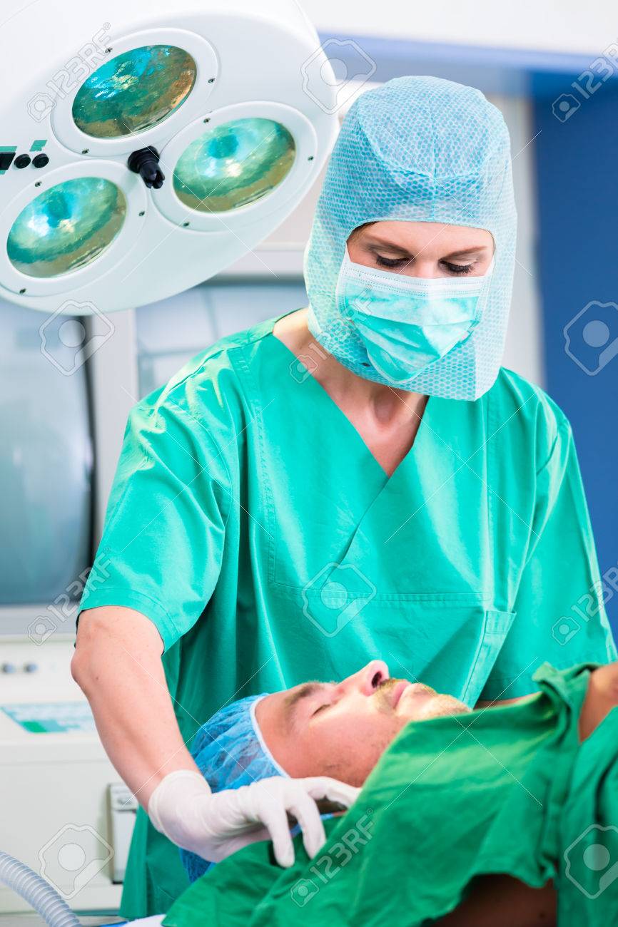 orthopedic surgeon doctor operating patient in surgery or hospital
