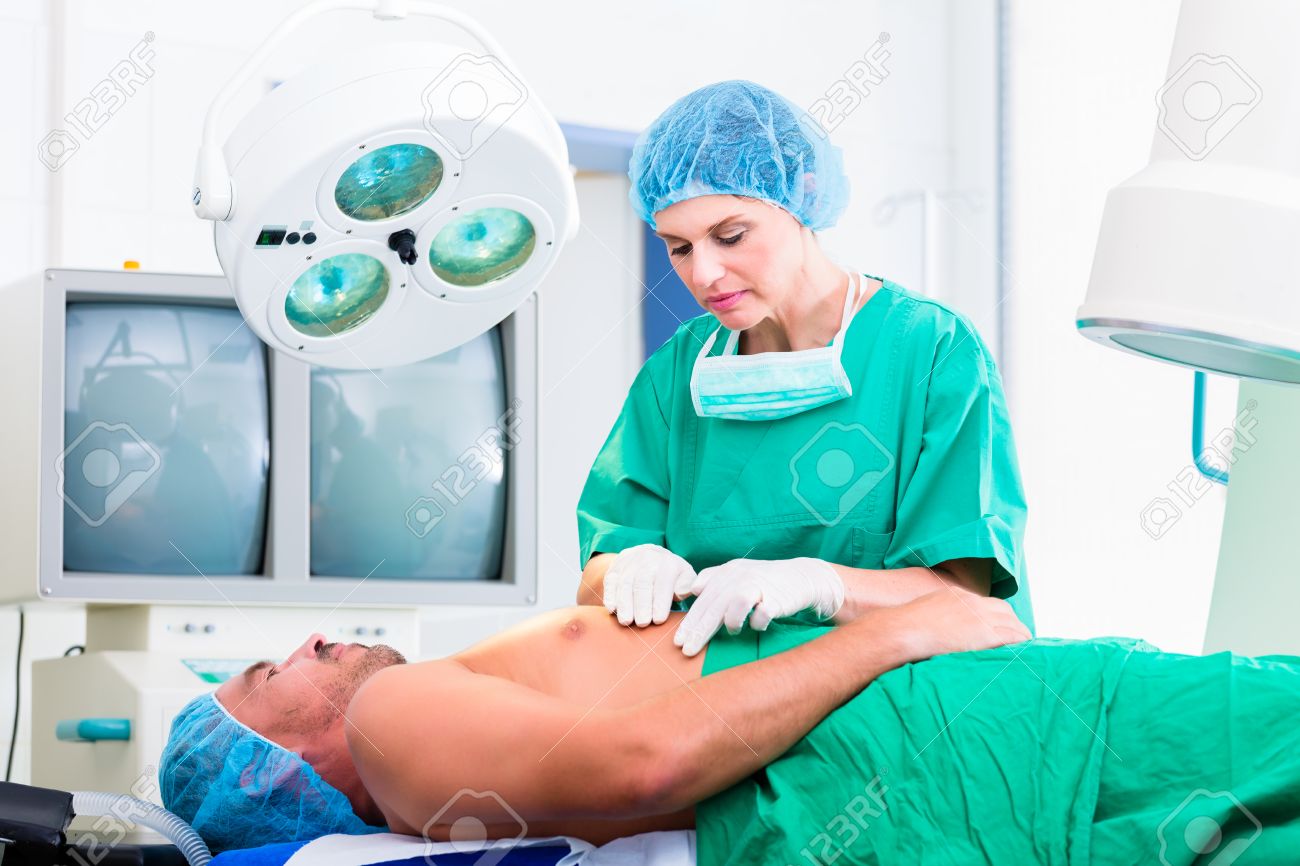 orthopedic surgeon doctor operating patient in surgery or hospital