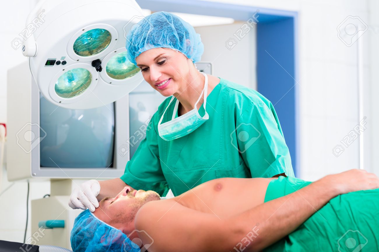 orthopedic surgeon doctor operating patient in surgery or hospital