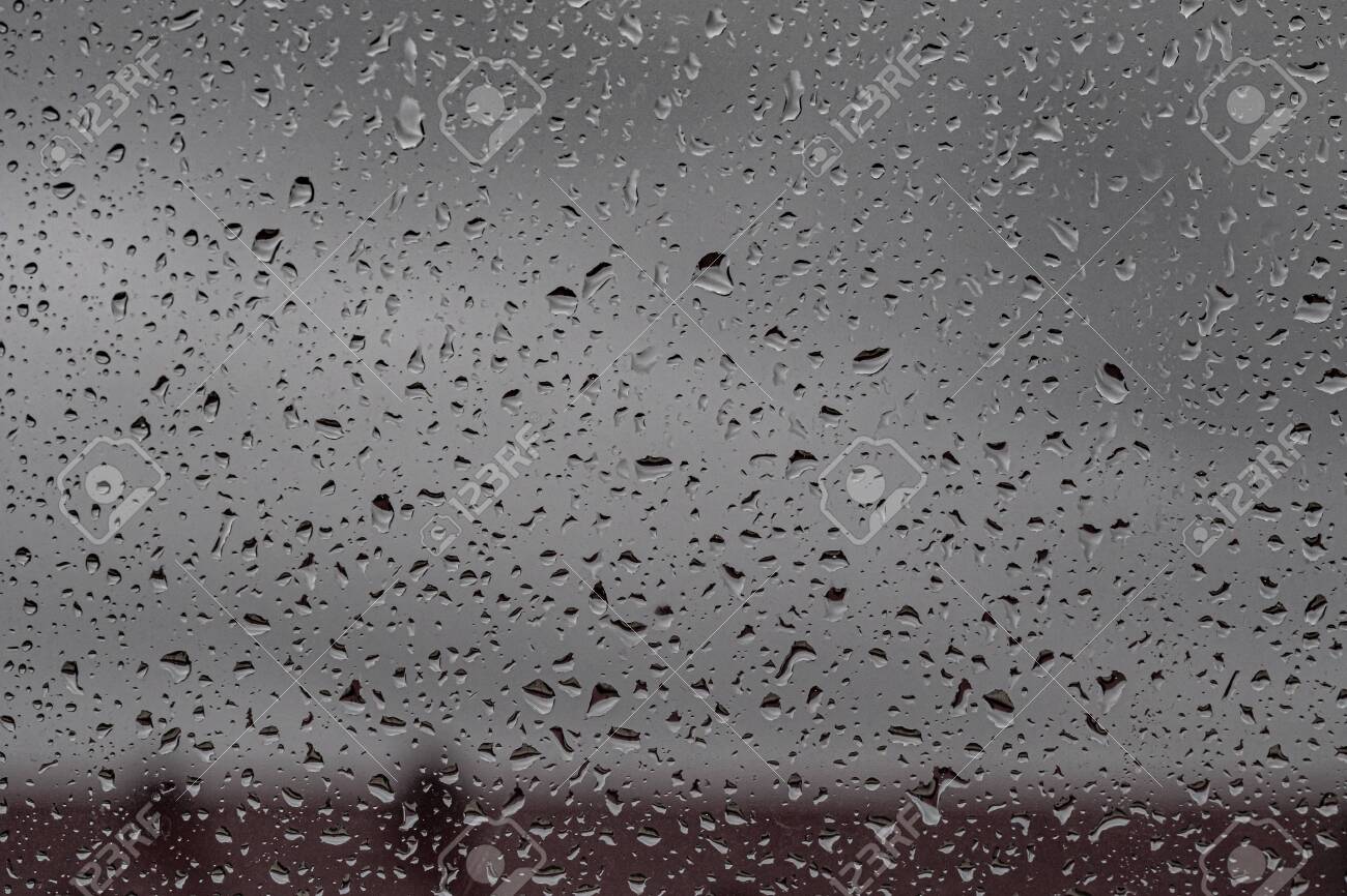 Raindrops On The Glass Gloomy Weather Gray Background Rain Gray Clouds Glass Texture Stock Photo Picture And Royalty Free Image Image