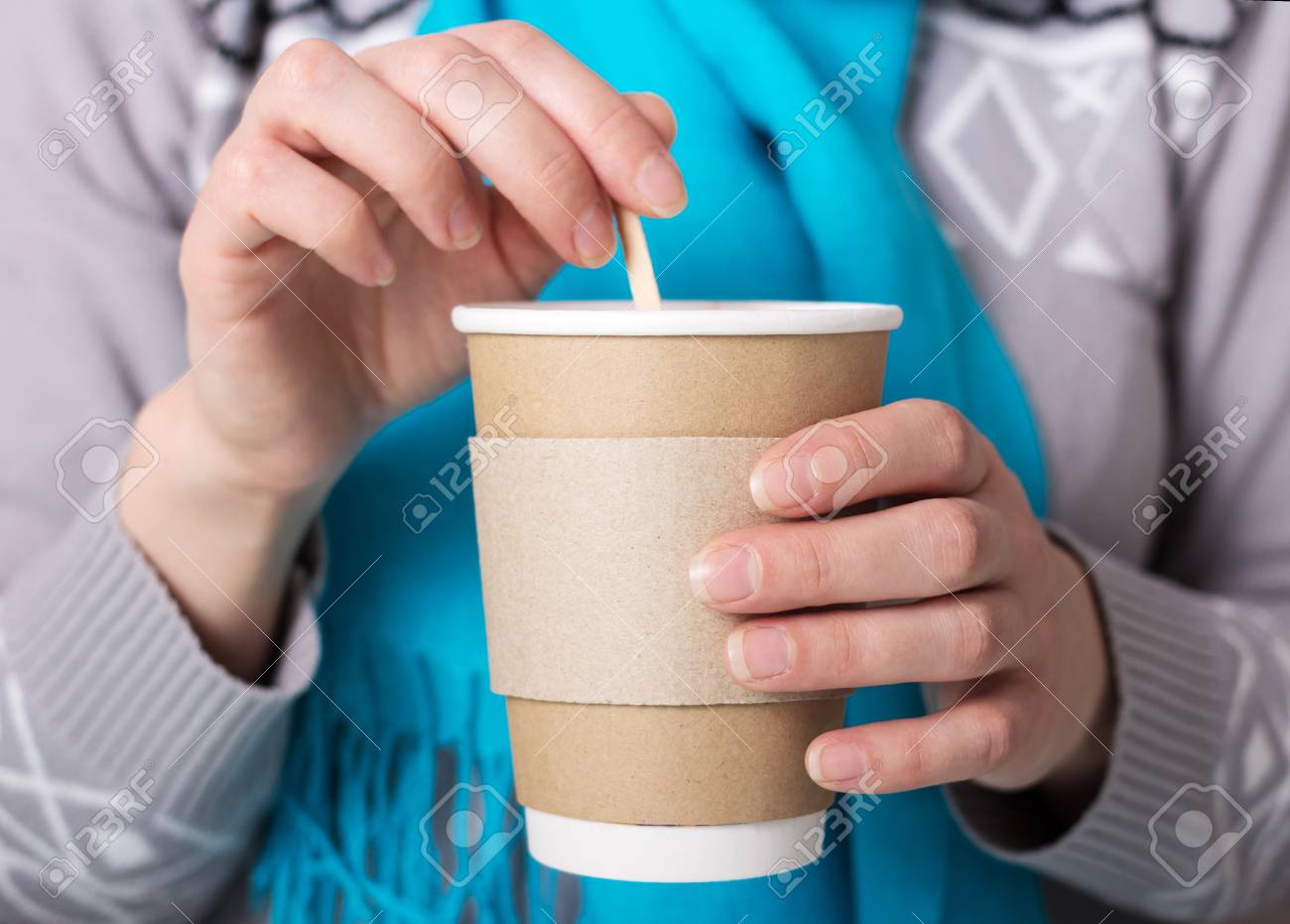 Special Cup for hot coffee takeaway, in hands of woman - 103925239 Special Cup for hot coffee takeaway, in hands of woman - 103925239