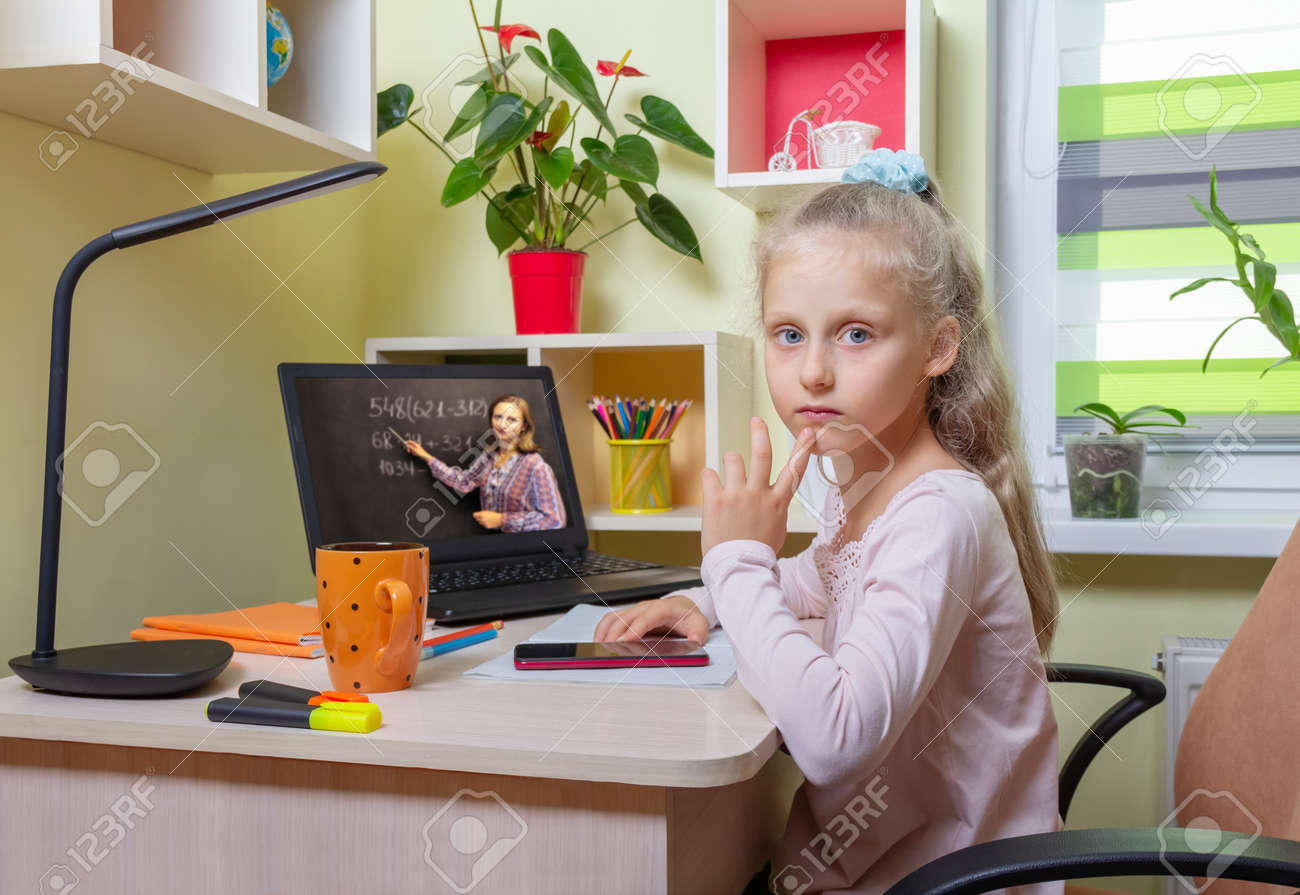 The girl pondered a difficult example. Online learning using a laptop from home - 170118045 The girl pondered a difficult example. Online learning using a laptop from home - 170118045
