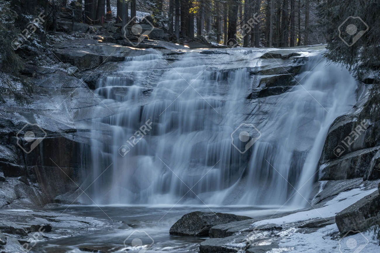 Cold spring morning with Mumlavske waterfalls near Harrachov town in Krkonose national park - 169798898 Cold spring morning with Mumlavske waterfalls near Harrachov town in Krkonose national park - 169798898