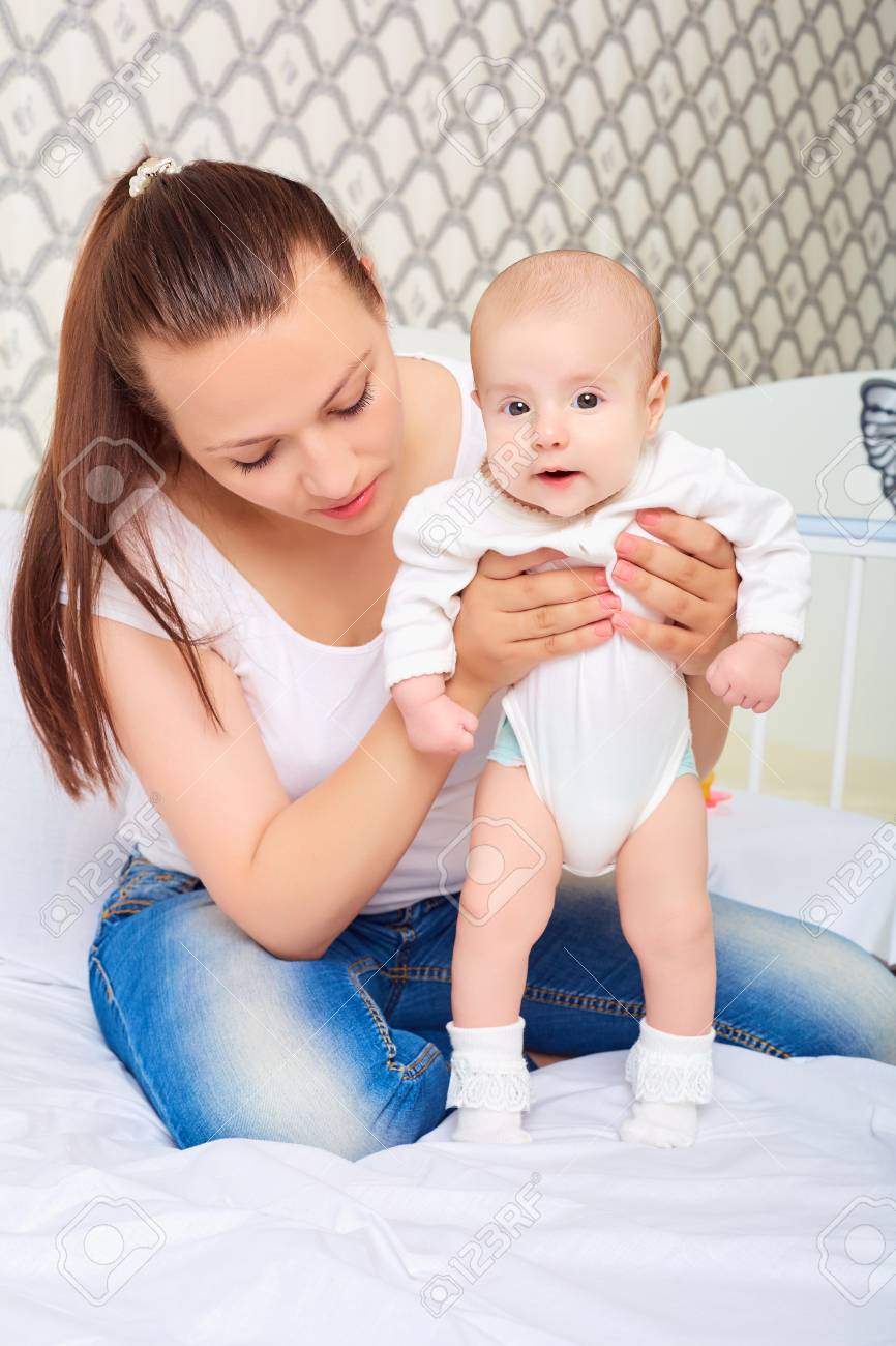Mom Teaching Baby Girl To Walk Baby Child Newborn Stock Photo Picture And Royalty Free Image Image 61658249