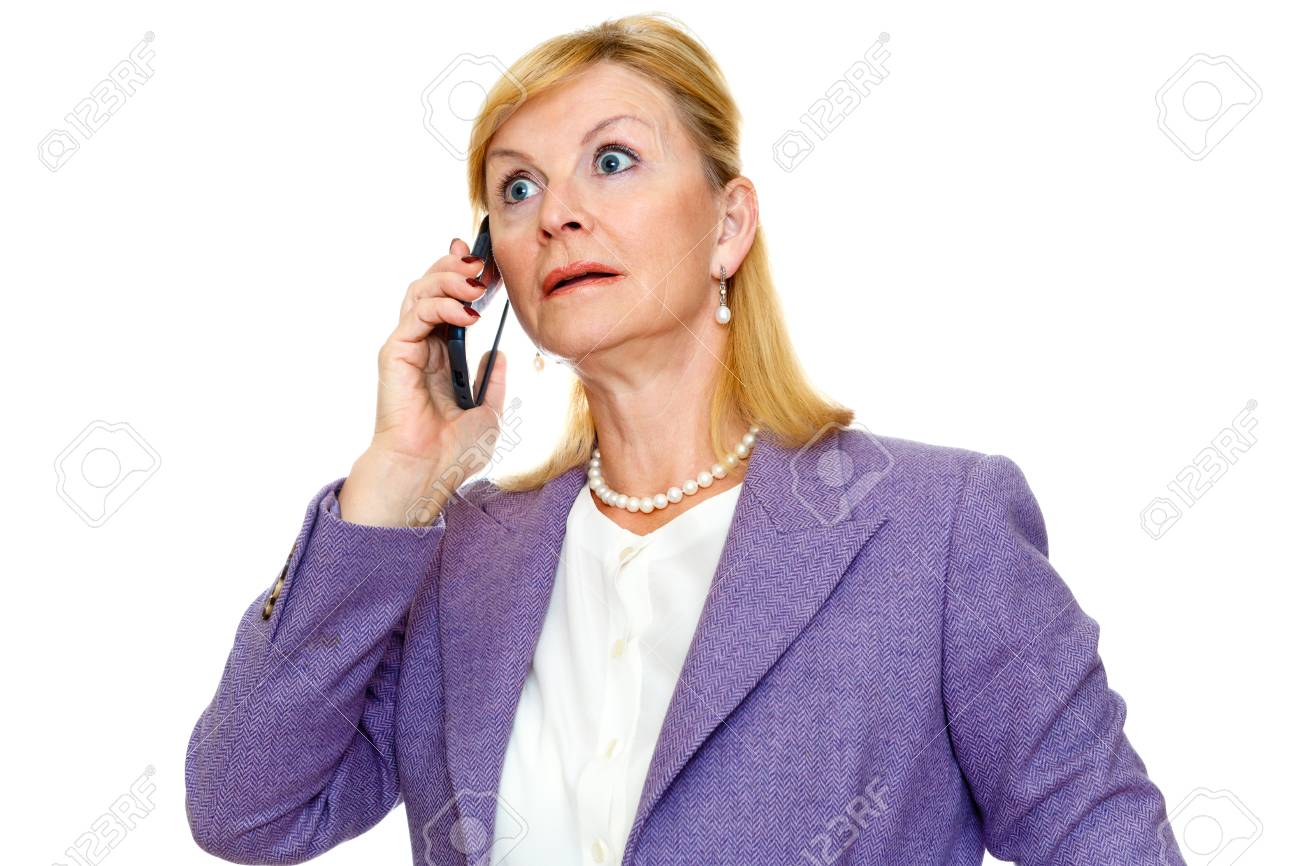Stock P O Surprised Senior Woman 60 65 Years Old In Suit With Big Eyes Talking On Cell Mobil Phone Isolated White Background Human Emotion Stock P O Surprised Senior Woman 60 65 Years Old In Suit With Big Eyes Talking On Cell Mobil Phone Isolated White Background Human Emotion