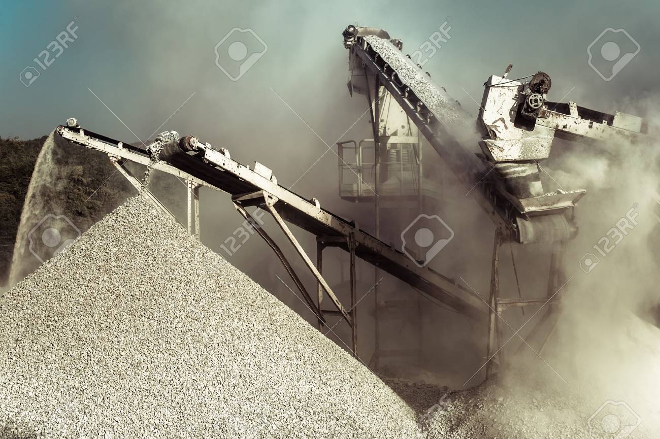 Industrial background with working gravel crusher - 53749906 Industrial background with working gravel crusher - 53749906