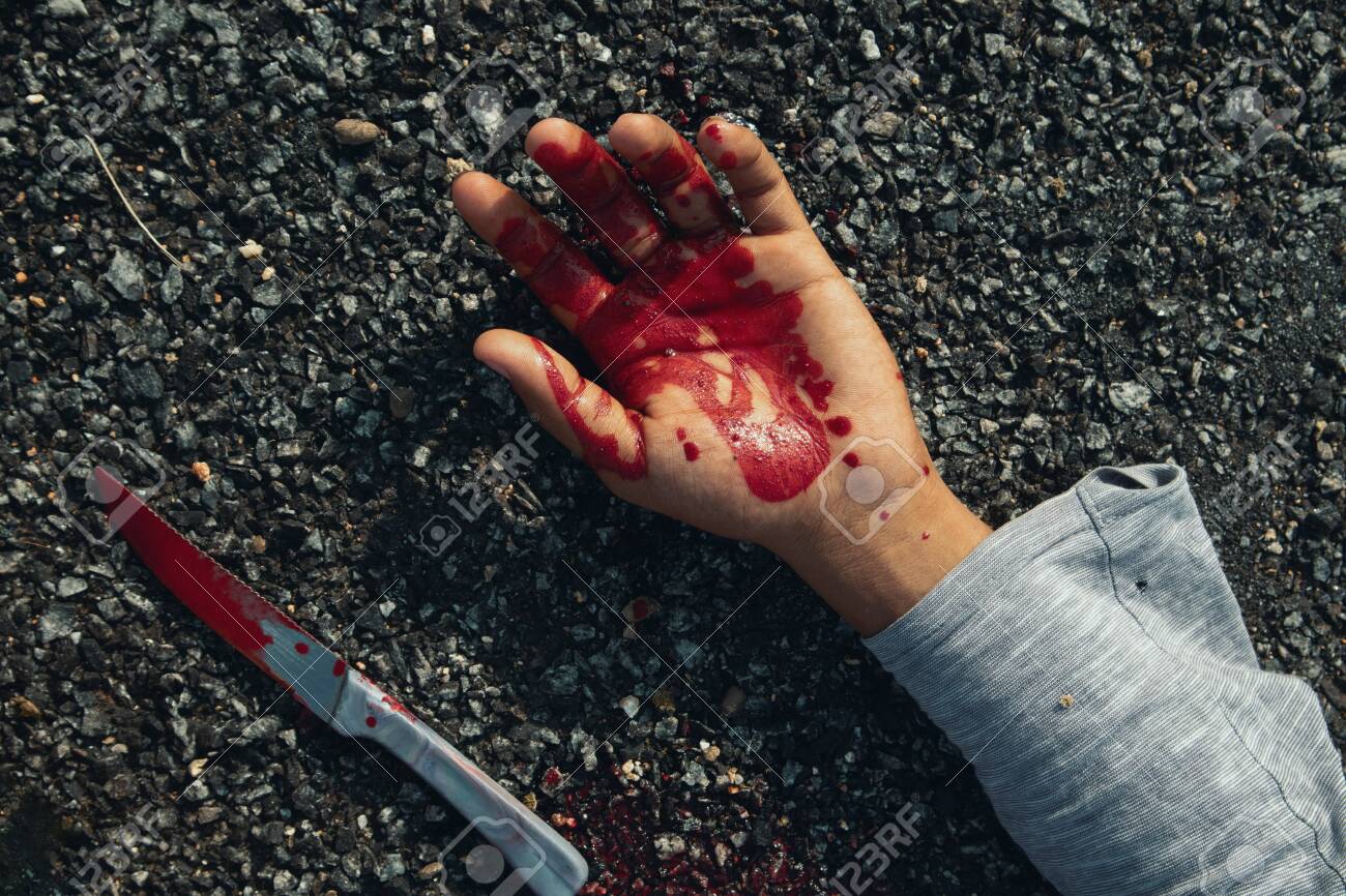 Close Up Of Hand With Blood And Bloody Knife On Road Stock Photo Picture And Royalty Free Image Image