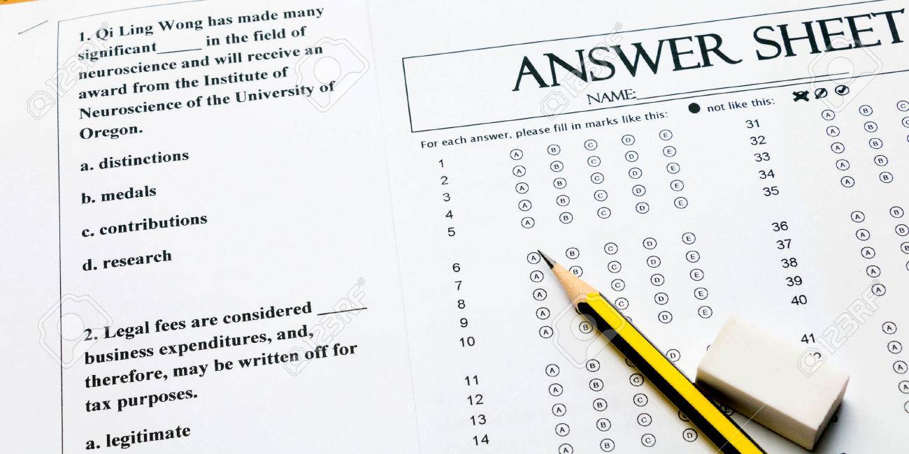 closeup english multiple choice question and answer sheet with pencil for english test Stock Photo -